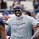 Jackson State football coach Deion Sanders smiles as he greets his defensive squad after they had recovered a Mississippi Valley State fumble for a touchdown during the second half of an NCAA college football game, Sunday, March 14, 2021, in Jackson, Miss. Sanders is trying to win games at Jackson State and raise the profile of historically black colleges and universities around the nation.